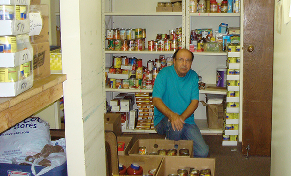Jim Wojcik in church food pantry
